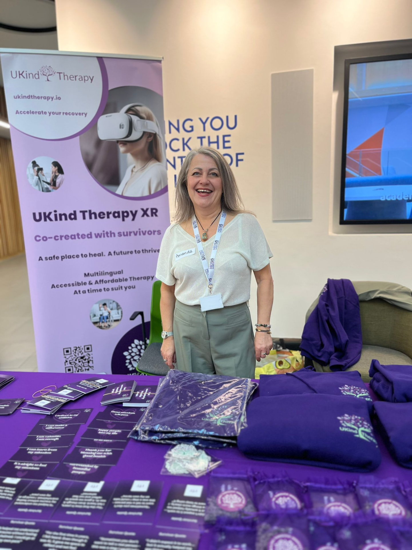 Amanda Haigh at the UKind Therapy XR stand at a therapy conference
