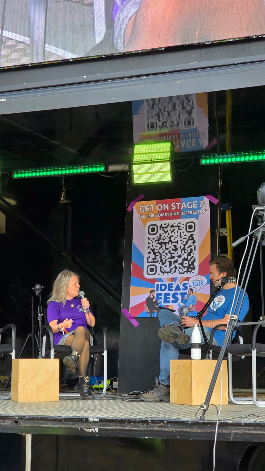Amanda Haigh speaking on stage in conversation at Ideas Fest